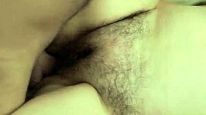 A mature woman with unshaved pubic hair receives penetration